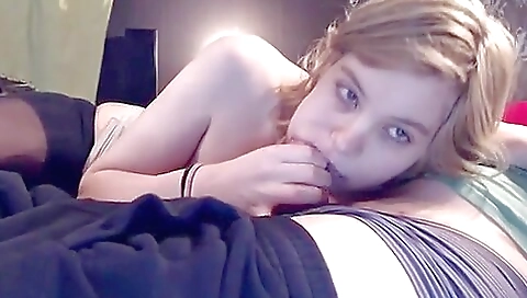 Blonde babe in a swimsuit sucks and rides cock in a homemade video